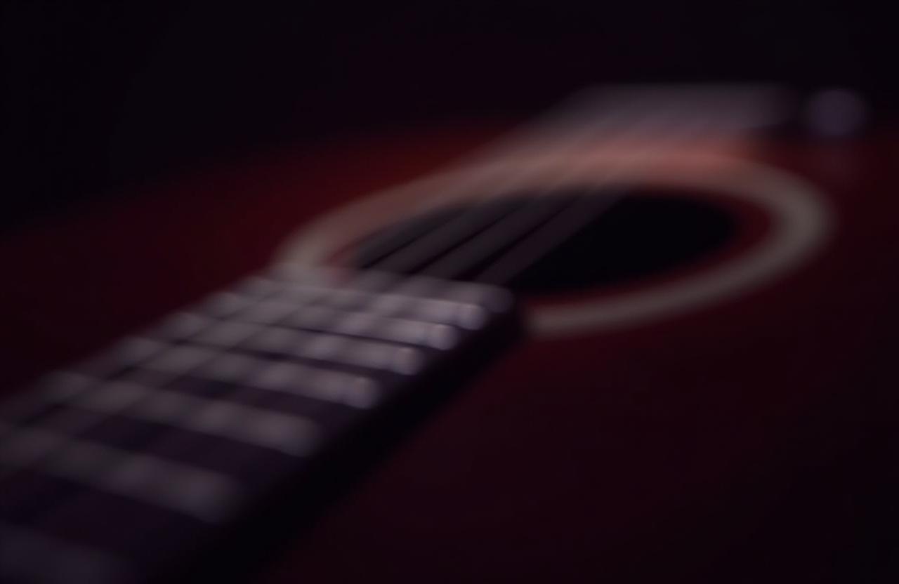 Close up of guitar strings and wood textures